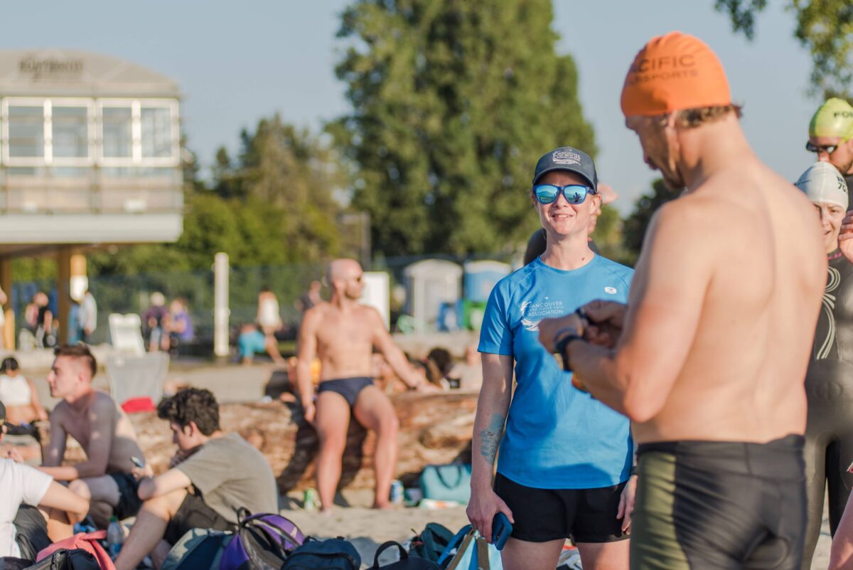 Swimmers checking in and out at practice swim